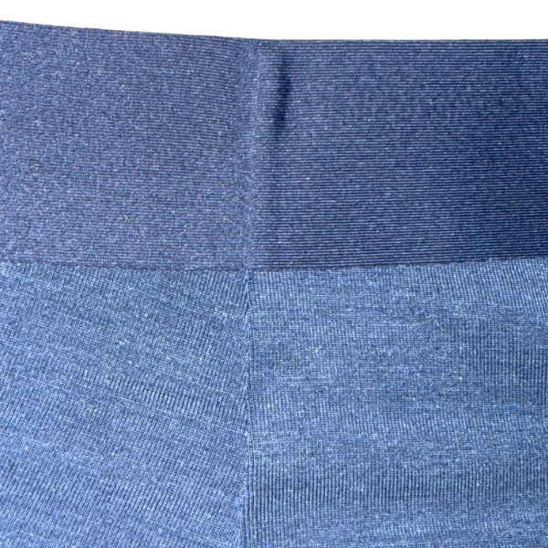 Close-up of blue fabric with a subtle pattern