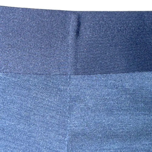 Close-up of blue fabric with a subtle pattern