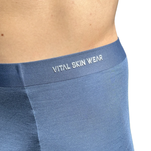 Blue underwear with 'Vital Skin Wear' waistband on a white background